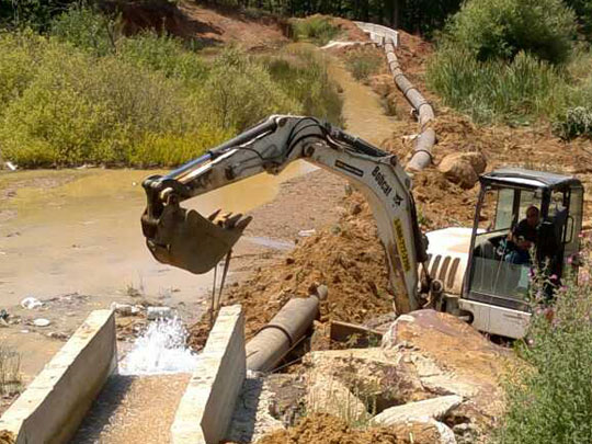Construction of Water pipes from Al Assi spring and cement canals from Al jouayzat spring