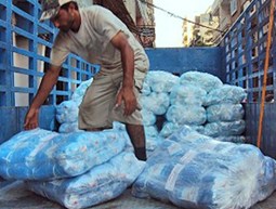 Distribute  fishing nets to fishermen in Tripoli